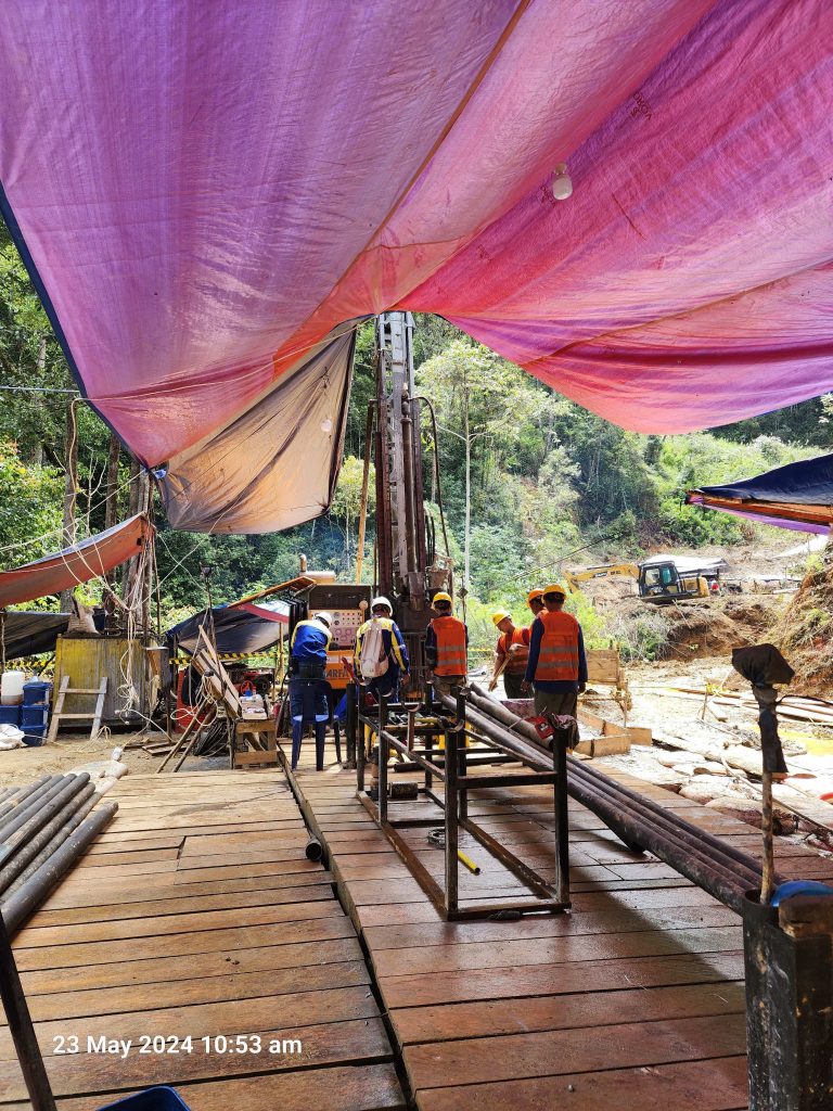 Timber platform and drill deck under tarp canopy